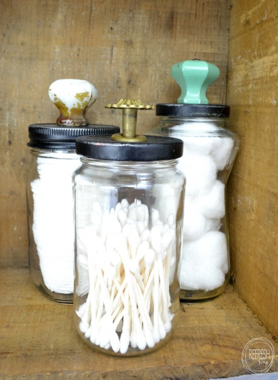 Ways to Upcycle Glass Jars & Bottles: Reuse old glass jars for bathroom storage and organization from Refresh Living. 