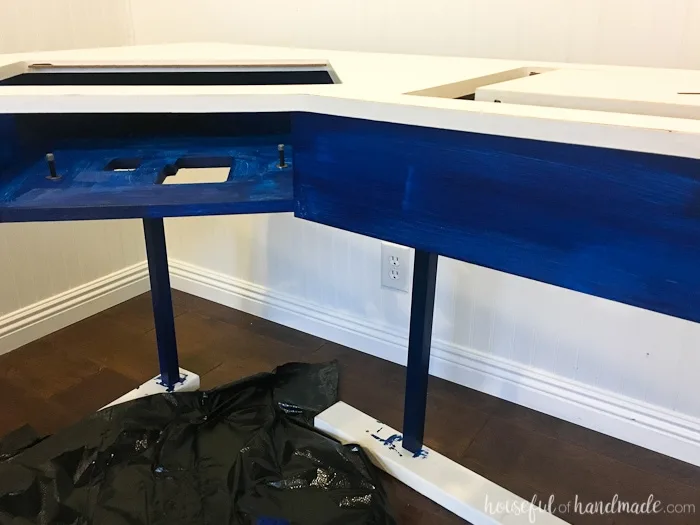 Transform an old utilitarian table into a beautiful farmhouse craft table with this sewing machine table makeover. The beautiful table legs were created on a budget to transform the basic table into a piece of furniture with lots of style. Housefulofhandmade.com | Furniture Makeover | Chalk Paint Makeover | Farmhouse Table Legs | Sewing Desk | $100 Room Challenge