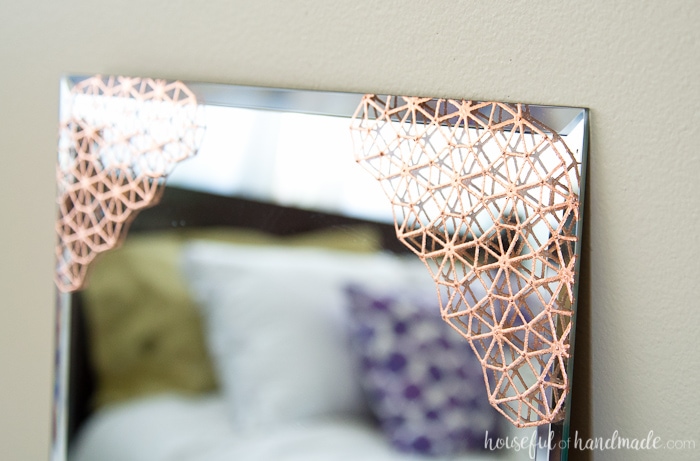 Add beautiful metal accents to a plain mirror. This DIY copper mirror is the perfect accent mirror for any room. Housefulofhandmade.com | DIY Home Decor | DIY Mirror Ideas | Copper Home Accents | Spellbinders