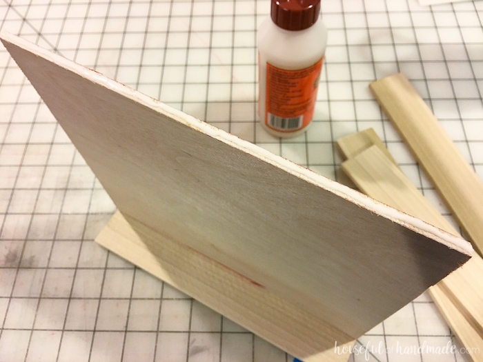 Glueing one side of the nightstand tray to the bottom plywood. 