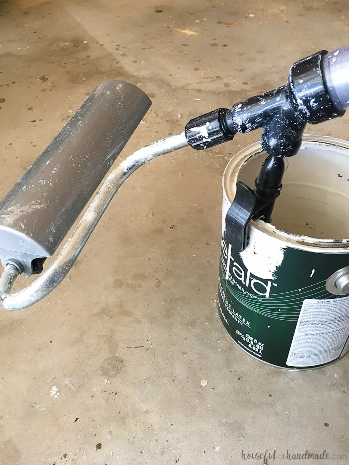 paint stick being used in paint can