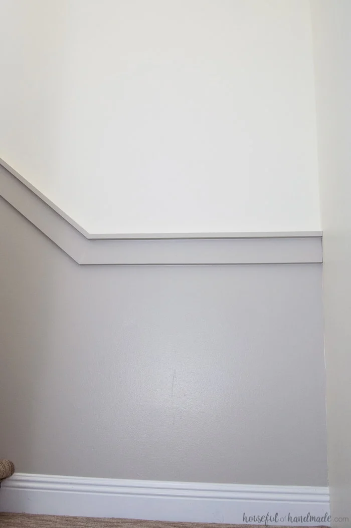 freshly painted walls in gray paint with white trim 