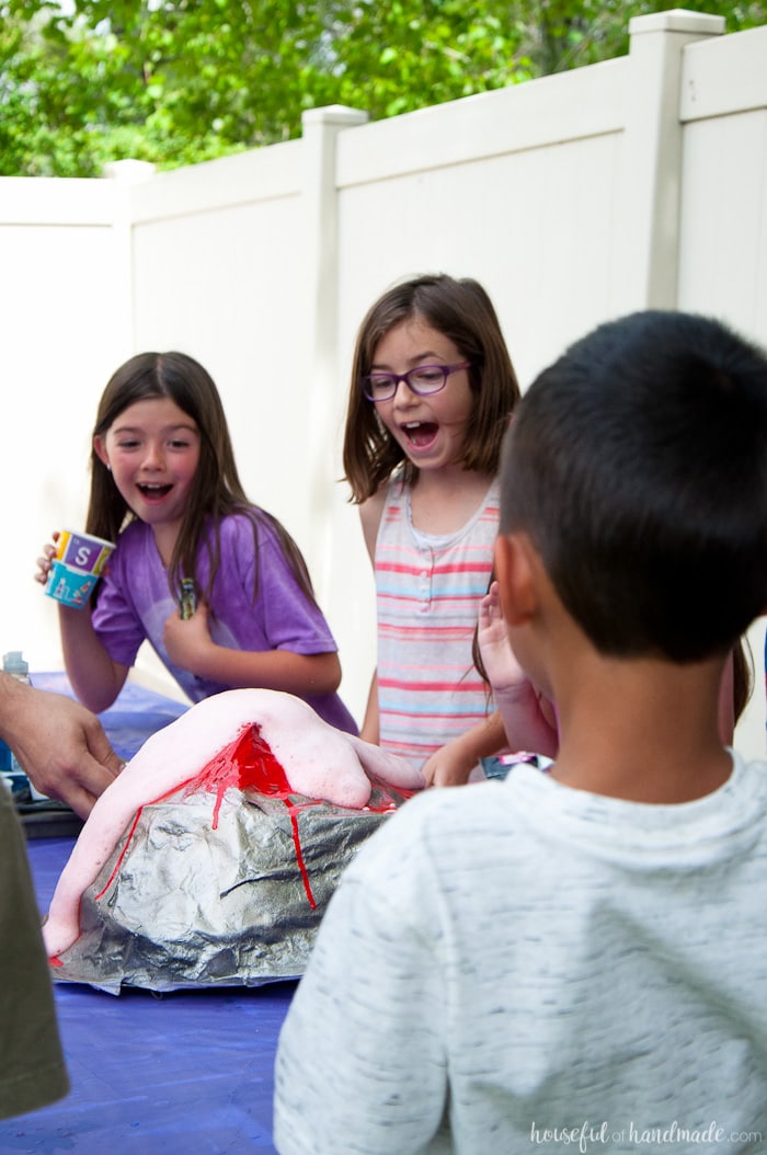 volcano erupting as a successful experiment at a children's science themed birthday party