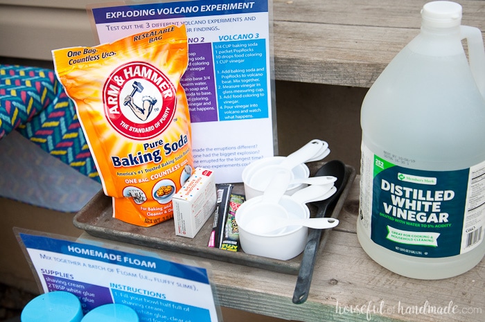 supplies on a table for children's science experiment with a list of instructions