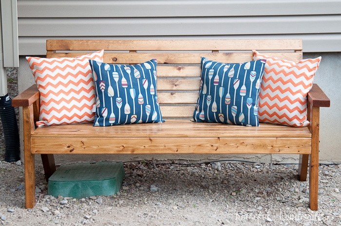 Get ready to spend time outside with these Slatted Outdoor Sofa Build Plans. This outdoor seating is beautifully built with mostly 2x4s, but looks much more expensive. It features slatted seat that can be used with or without sofa cushions. The beautiful lines of the legs are inspired by classic Adirondack chairs. Housefulofhandmade.com | Free woodworking plans | Kreg Pocket Holes | Outdoor Bench | DIY Patio Furniture | Rustic Outdoor Sofa | DIY Outdoor Sofa 