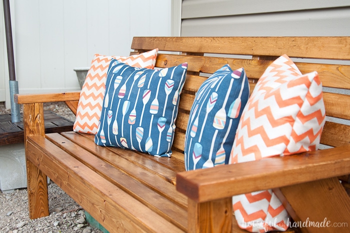 Get ready to spend time outside with these Slatted Outdoor Sofa Build Plans. This outdoor seating is beautifully built with mostly 2x4s, but looks much more expensive. It features slatted seat that can be used with or without sofa cushions. The beautiful lines of the legs are inspired by classic Adirondack chairs. Housefulofhandmade.com | Free woodworking plans | Kreg Pocket Holes | Outdoor Bench | DIY Patio Furniture | Rustic Outdoor Sofa | DIY Outdoor Sofa 