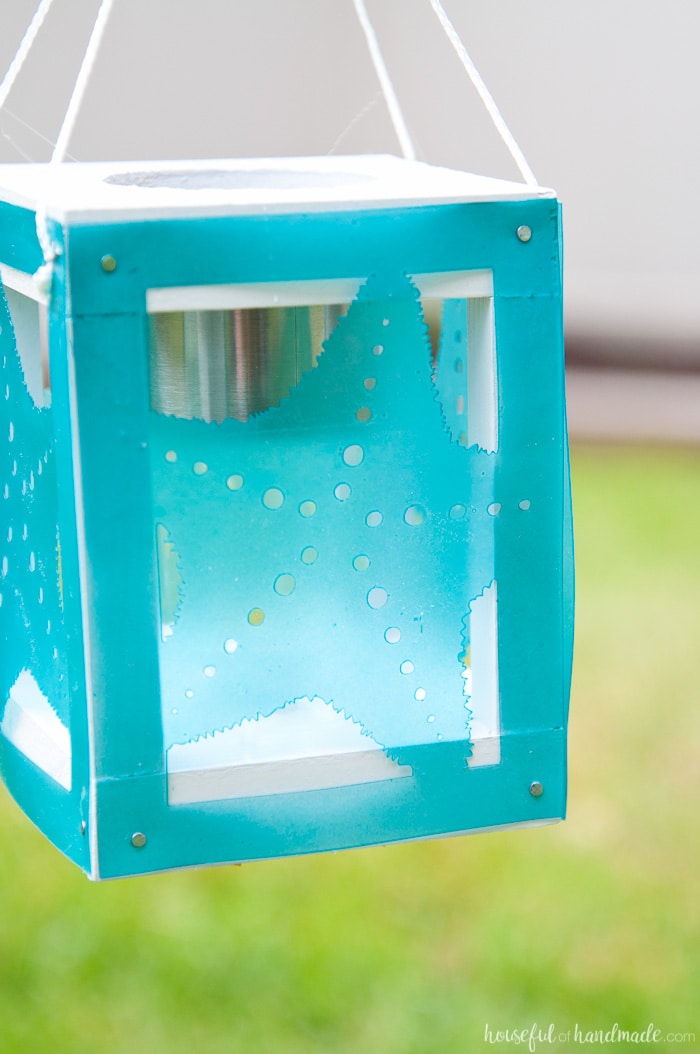 Create beautiful beach themed decor for the backyard with scrap wood, cheap solar path lights and your Silhouette Cameo. These coastal solar lantern decor will give beautiful lighting to the warm summer evenings. A fun and easy DIY for summer decorating. Housefulofhandmade.com | Silhouette Creators Challenge | Silhouette Crafts | Outdoor Crafts | DIY Solar Lanterns | Decorative Solar Lights 