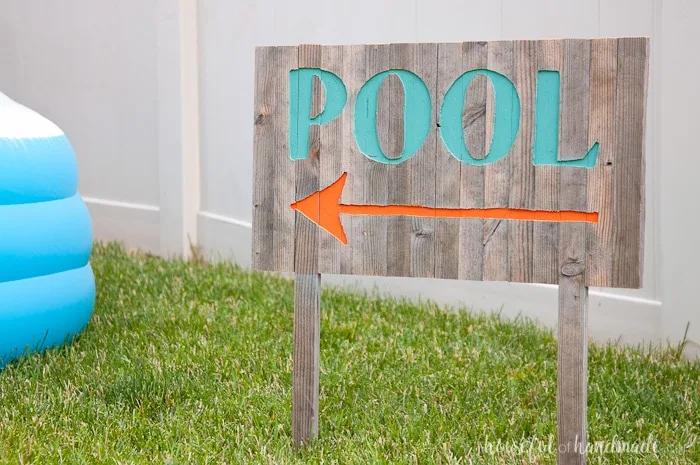 Create the perfect outdoor decor for summer with this DIY wood sign with a router. Using reclaimed wood, the 3D pool sign is perfect for your next party! Housefulofhandmade.com | Router Sign | Reclaimed Wood Sign | How to Make a Sign with a Router | Scrap Wood Projects | Summer Sign | Outdoor Sign