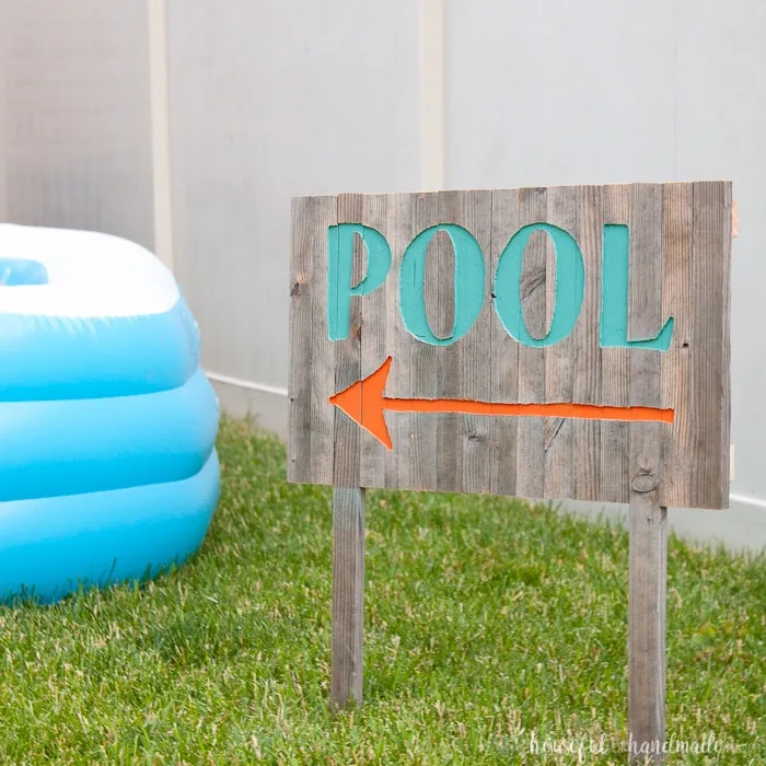 Create the perfect outdoor decor for summer with this DIY wood sign with a router. Using reclaimed wood, the 3D pool sign is perfect for your next party! Housefulofhandmade.com | Router Sign | Reclaimed Wood Sign | How to Make a Sign with a Router | Scrap Wood Projects | Summer Sign | Outdoor Sign