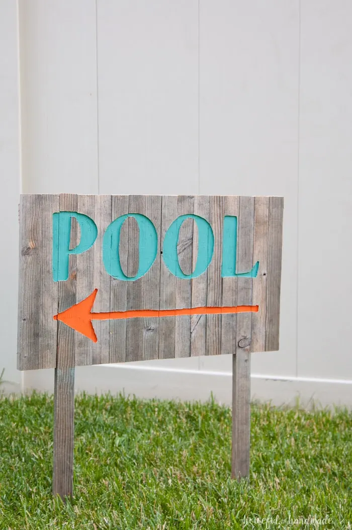 Create the perfect outdoor decor for summer with this DIY wood sign with a router. Using reclaimed wood, the 3D pool sign is perfect for your next party! Housefulofhandmade.com | Router Sign | Reclaimed Wood Sign | How to Make a Sign with a Router | Scrap Wood Projects | Summer Sign | Outdoor Sign