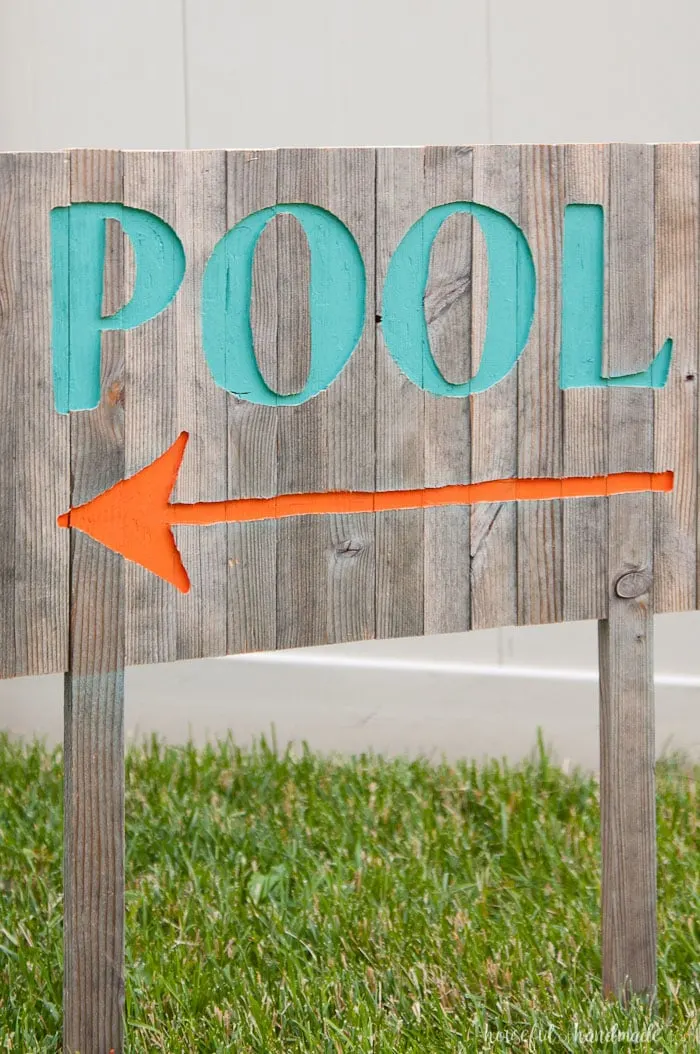 Create the perfect outdoor decor for summer with this DIY wood sign with a router. Using reclaimed wood, the 3D pool sign is perfect for your next party! Housefulofhandmade.com | Router Sign | Reclaimed Wood Sign | How to Make a Sign with a Router | Scrap Wood Projects | Summer Sign | Outdoor Sign