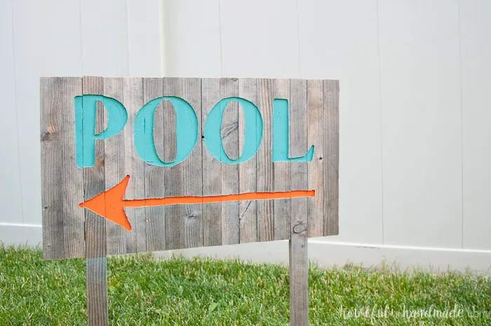 Create the perfect outdoor decor for summer with this DIY wood sign with a router. Using reclaimed wood, the 3D pool sign is perfect for your next party! Housefulofhandmade.com | Router Sign | Reclaimed Wood Sign | How to Make a Sign with a Router | Scrap Wood Projects | Summer Sign | Outdoor Sign