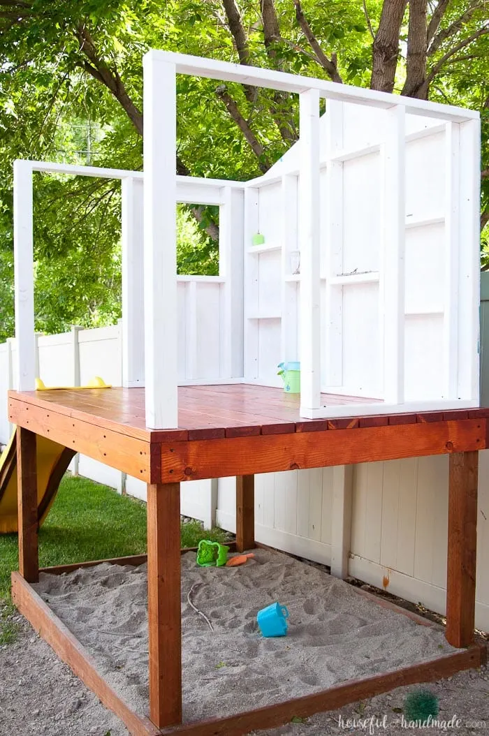 Create the perfect outdoor space for your kids this summer. Build a DIY playhouse for hours of imaginative play. This week we share the plans for the walls, including time and cost breakdown. Follow along at Housefulofhandmade.com | How to Build a Playhouse | DIY Swing Set | Small Playhouse | Playhouse Build Plans 