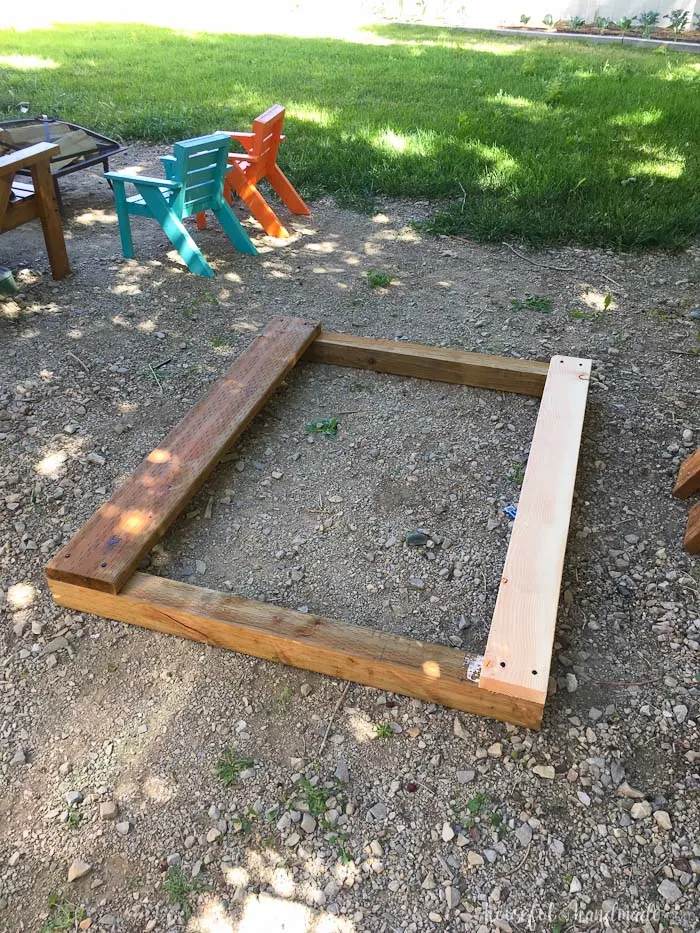 Even though our yard is small, we decided we still needed a DIY playhouse. Check out how we built the small playhouse for our kids, on a budget, starting with the deck. This project was so easy and now we can see the playhouse starting to take shape. Housefulofhandmade.com | How to Build a Playhouse | DIY Swing Set | Small Playhouse | Playhouse Build Plans 