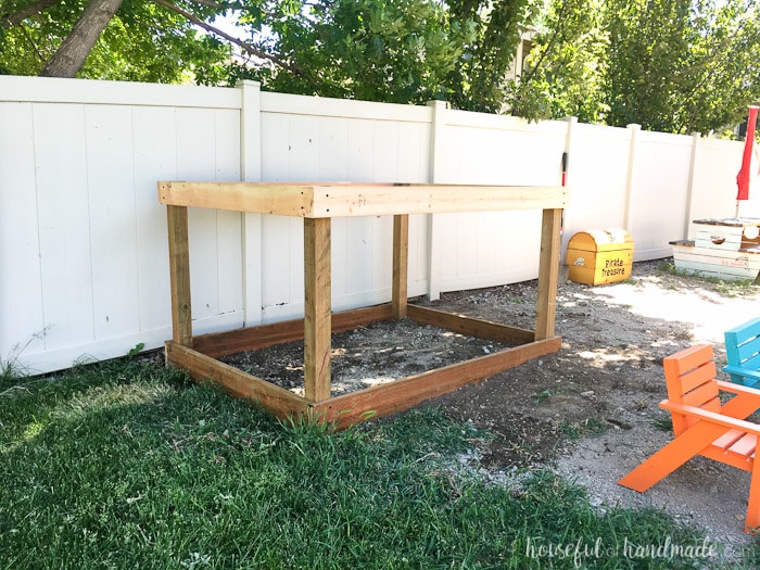 Even though our yard is small, we decided we still needed a DIY playhouse. Check out how we built the small playhouse for our kids, on a budget, starting with the deck. This project was so easy and now we can see the playhouse starting to take shape. Housefulofhandmade.com | How to Build a Playhouse | DIY Swing Set | Small Playhouse | Playhouse Build Plans 
