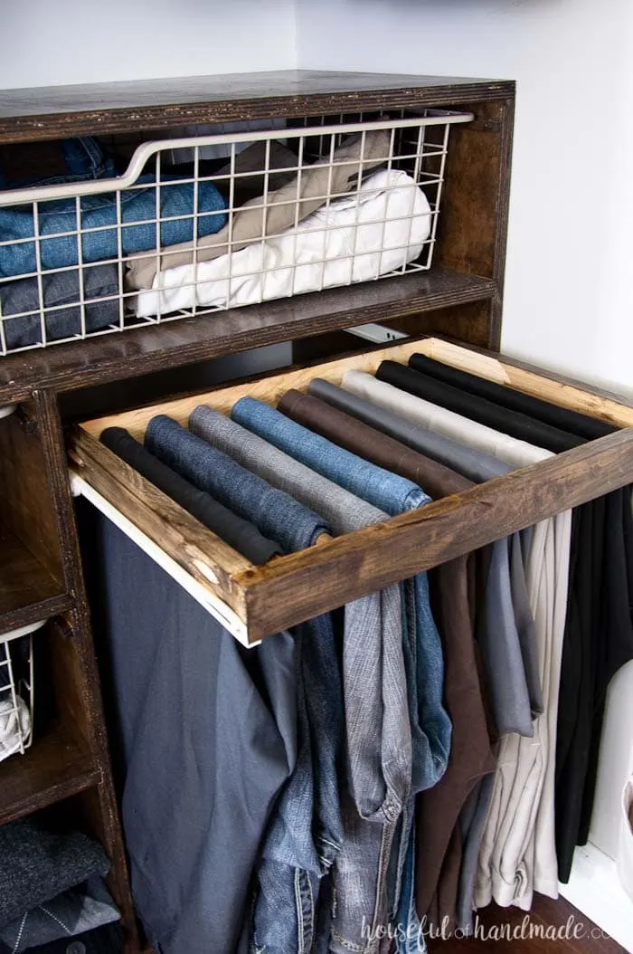 For just a few dollars, build a pull out rack to hang your pants. Our walk in closet reveal includes tons of closet storage organization ideas on a budget. Housefulofhandmade.com