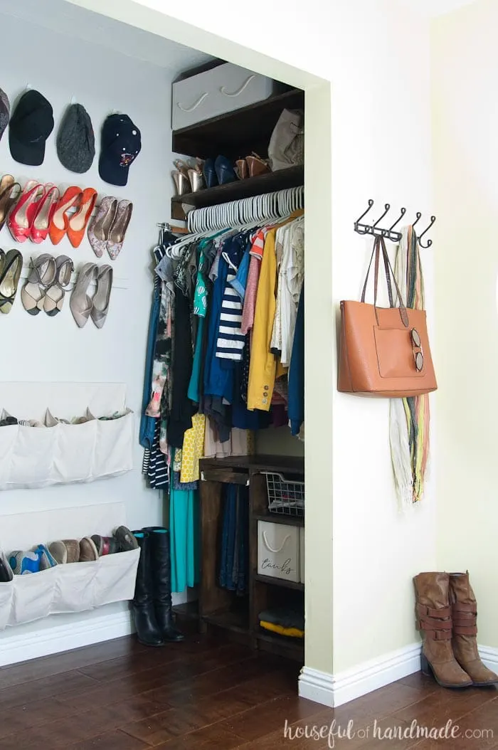 We reconfigured the entire layout of out tiny master bedroom closet and gained tons of storage. See how we turned our closet into a beautiful walk in closet for only $100. Housefulofhandmade.com