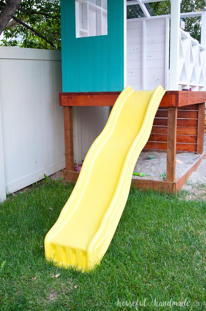 outdoor playhouse with climbing wall