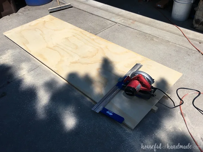 Cutting the plywood into 15" wide strips with a circular saw and guide. 