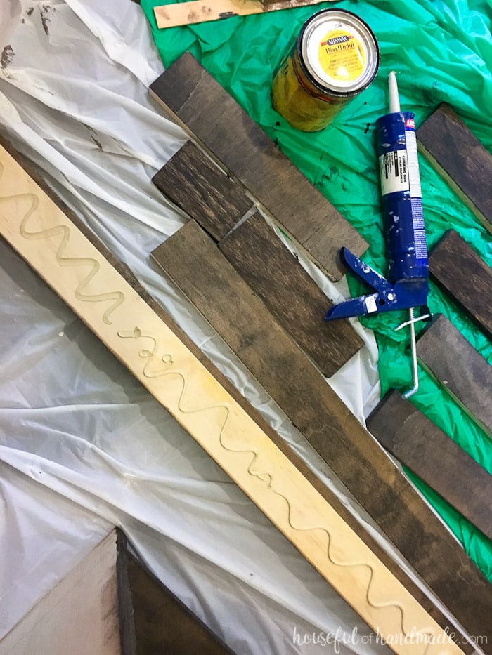 Adding liquid nails to the back of one of the closet shelf supports. 