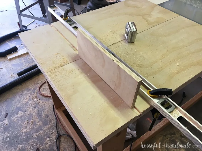 Two of the side pieces of the custom closet with a groove routed into the top for a shelf. 