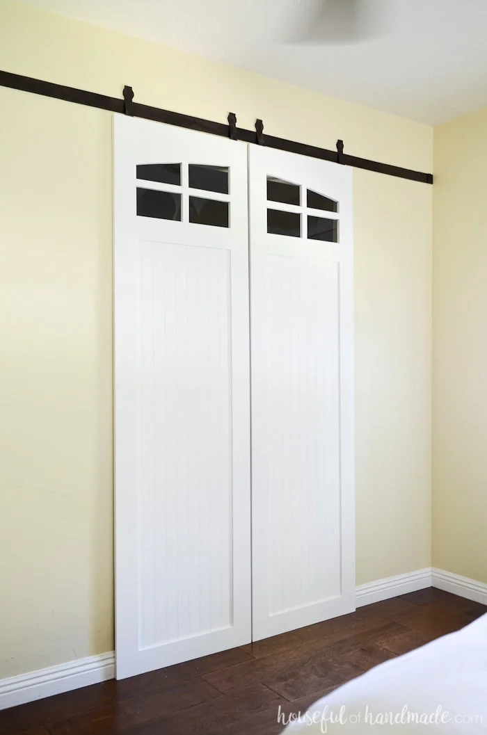 I love sliding barn doors and have never seen ones with windows. Learn how to make barn doors with the free build plans from Housefulofhandmade.com
