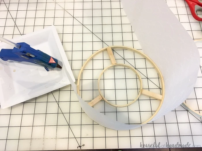 Use vellum and embroidery hoops to upcycle an old light fixture. Create a beautiful drum ceiling light fixture. Housefulofhandmade.com