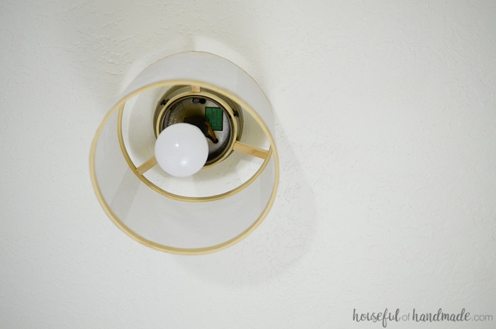 Turn embroidery hoops and vellum into a beautiful drum ceiling light. Its the perfect upcycled light fixture for the hallway. Housefulofhandmade.com