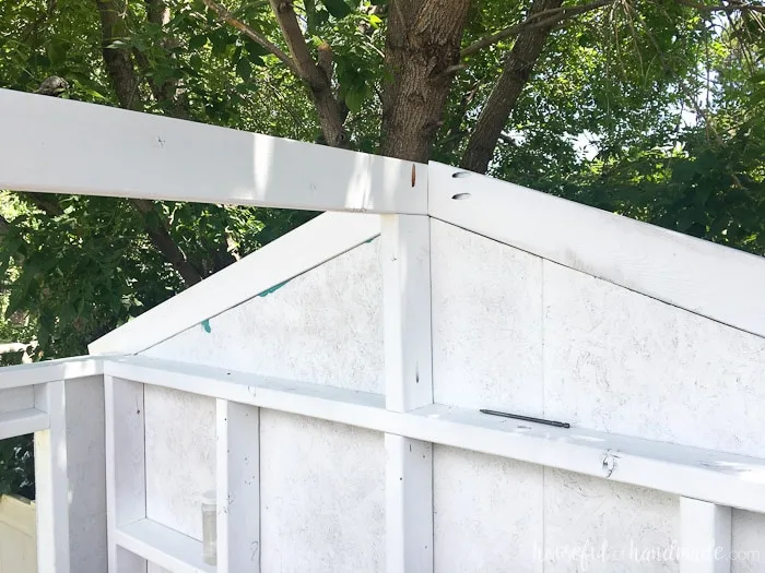 Create a DIY playhouse for your backyard this summer. See how to roof it with corrugated panels on Housefulofhandmade.com