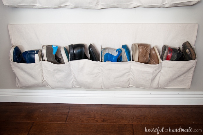 This drop cloth hanging shoe storage was made for less than $10 (for 2) and are the perfect way to keep all your shoes off the floor. Housefulofhandmade.com