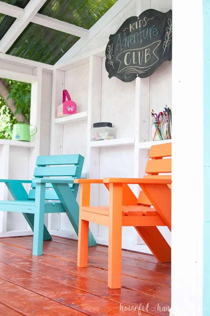 The bright colored kids patio chairs turn this outdoor playhouse into the perfect clubhouse. See the entire build at Housefulofhandmade.com