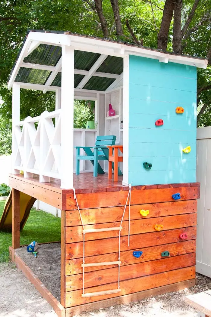 Since the yard is small, we are utilizing every inch of space by turning the wall of the outdoor playhouse into a climbing wall for more fun! Housefulofhandmade.com