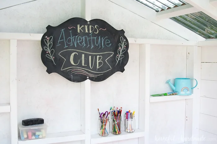 A chalkboard is the perfect addition to this outdoor playhouse. Housefulofhandmade.com
