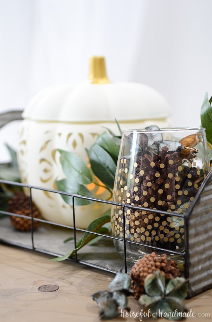 Create the perfect vignette for fall with this easy filigree punched ceramic pumpkin craft. Housefulofhandmade.com