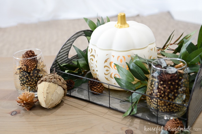 I love this beautiful knockoff design! See how easy it was to make this filigree punched ceramic pumpkin. Housefulofhandmade.com