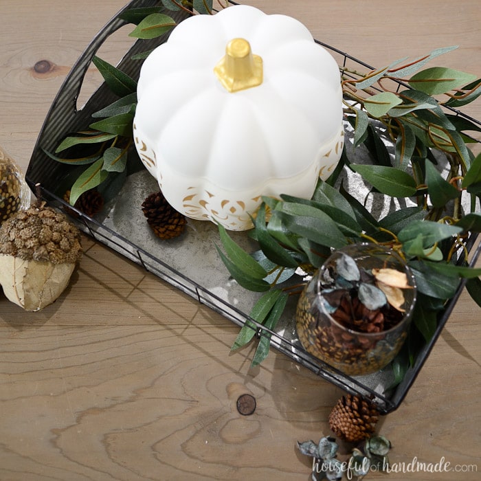 This beautiful filigree punched ceramic pumpkin is the perfect centerpiece for a rustic fall vignette. Housefulofhandmade.com