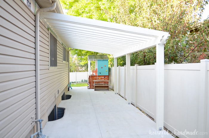 Build a pergola on a budget! Learn how to use inexpensive wood but make it look amazing. Housefulofhandmade.com