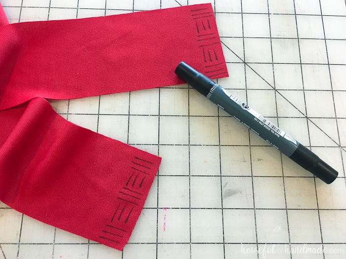 Red Knit fabric marked with DIY Moana costume. 