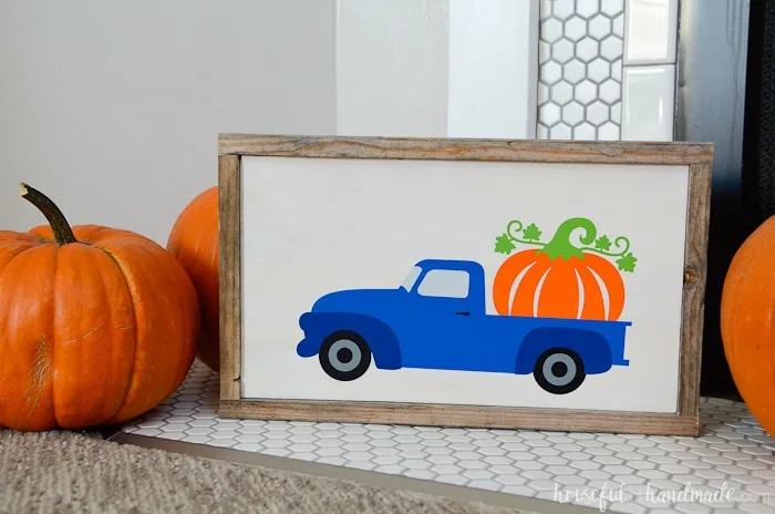 This wood pumpkin sign is perfect to add a bit of whimsy to your rustic fall decor. A scrap of plywood and some reclaimed wood was turned into the perfect frame for the pumpkin truck design. Housefulofhandmade.com