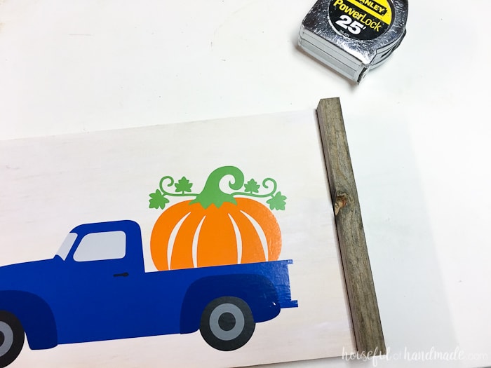 Add a reclaimed wood frame to the wood pumpkin sign. Housefulofhandmade.com