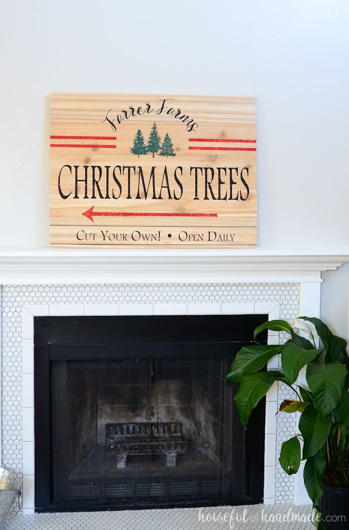 It's the beginning of our Christmas mantel. I love this easy DIY Christmas tree farm sign. Housefulofhandmade.com