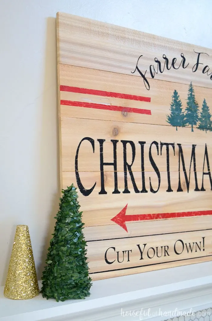 I love the idea of a mantel full of Christmas trees! This Christmas tree farm sign is the perfect centerpiece for it. Housefulofhandmade.com