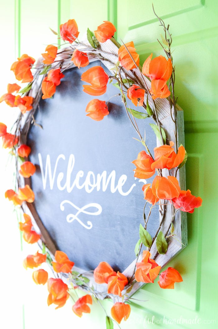 Need fun fall wreath ideas? This reclaimed wood chalkboard wreath is perfect for welcoming your guests during the season. The frame is built from reclaimed wood scraps. Housefulofhandmade.com