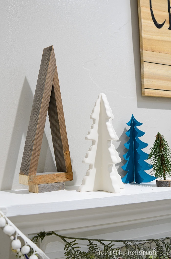 I love these reclaimed wood Christmas trees. The entire Christmas tree farm mantel is beautiful. Housefulofhandmade.com