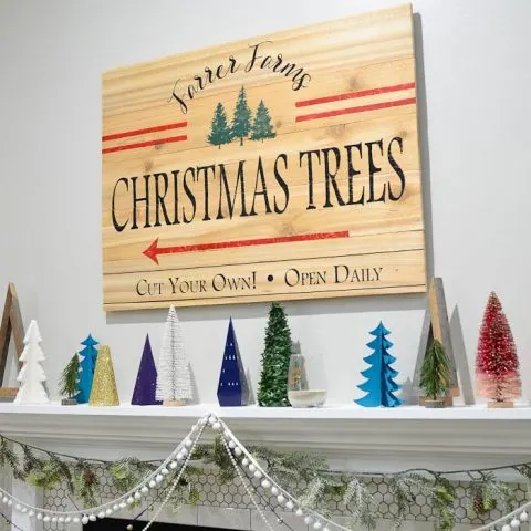 DIY a big wood sign on a budget from cedar fence pickets. It's the perfect centerpiece for this holiday mantel. Housefulofhandmade.com