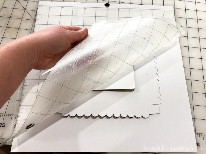 Tip for removing paper from a sticky cutting mat. Housefulofhandmade.com