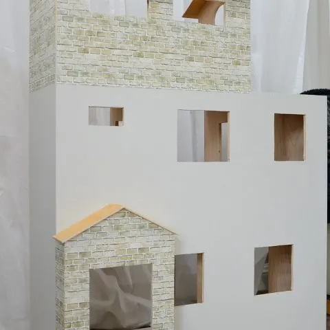 This is the perfect handmade gift idea for a girl. Build a Barbie dollhouse out of plywood. Housefulofhandmade.com