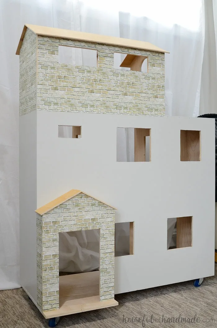 Barbie dollhouse out of plywood with brick