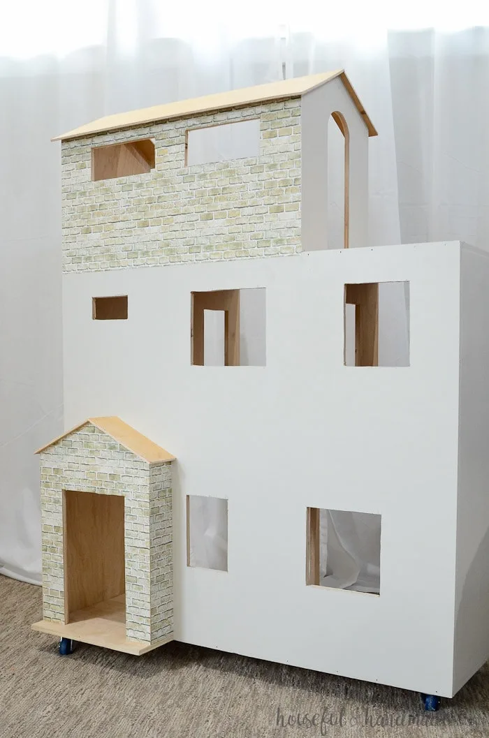 DIY Handmade plywood dollhouse in white with faux brick