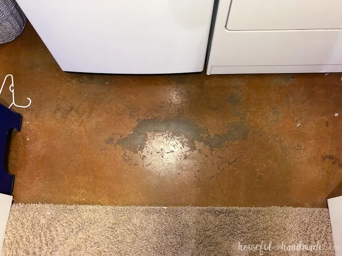 Transform an old cement floor on a budget with this $100 laundry room makeover. Housefulofhandmade.com